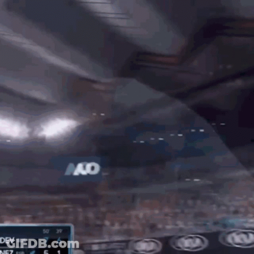 Man In Green Shirt Playing Tennis GIF