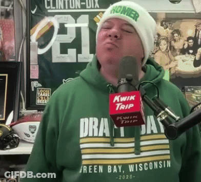 Man In Green Shirt Saying Green Bay Wisconsin Singing Into Kwik Trip Microphone GIF