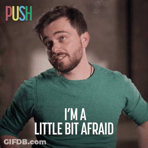 Man In Green Shirt Saying Im A Little Bit Afraid GIF