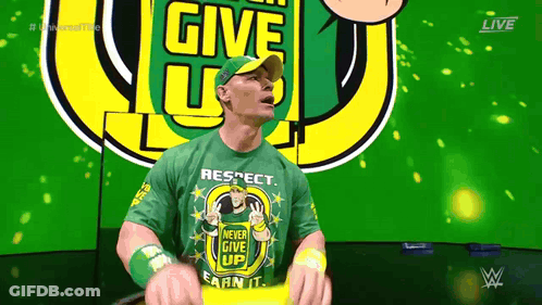 Man In Green Shirt Saying Never Give Up GIF