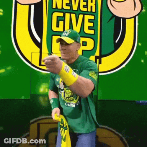 Man In Green Shirt Saying Never Give Up GIF