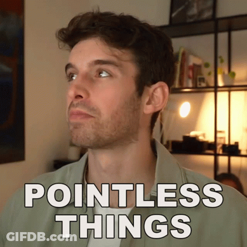 Man In Green Shirt Saying Pointless Things In Front Of Bookshelf GIF