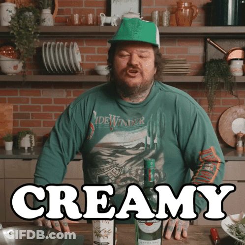 Man In Green Shirt Saying Sidewinder In Front Of Creamy Bottle GIF