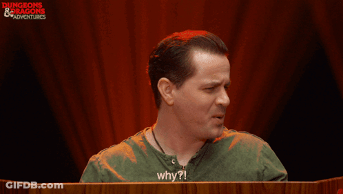 Man In Green Shirt Saying Why In Front Of Red Curtain GIF