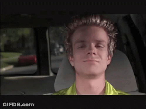 Man In Green Shirt Sitting In Car Eyes Closed GIF