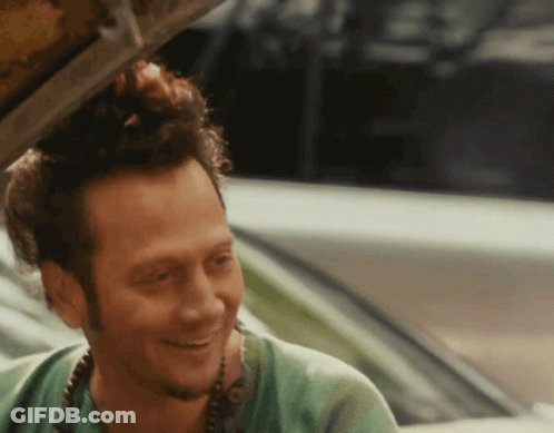 Man In Green Shirt Smiling In Car GIF