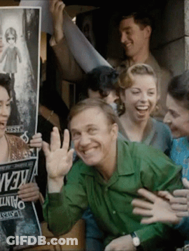 Man In Green Shirt Surrounded By Kevin Signs GIF