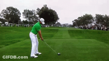 Man In Green Shirt Swinging Golf Club GIF
