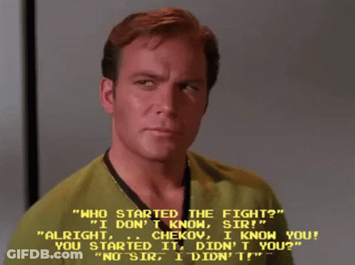 Man In Green Shirt Talking To Man In Yellow Shirt GIF