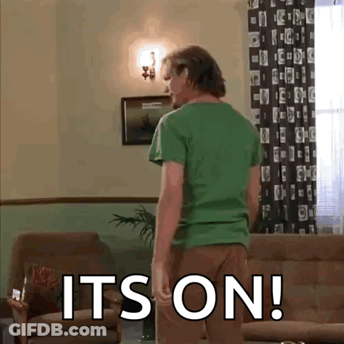 Man In Green Shirt With It's On Floor GIF