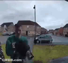 Man In Green Shirt With Letter L GIF