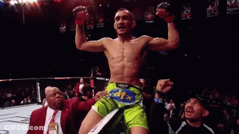 Man In Green Shorts In Boxing Ring GIF
