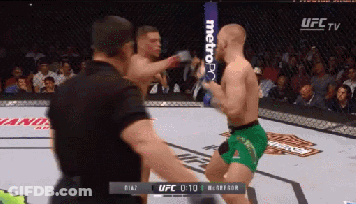 Man In Green Shorts Kicking Opponent GIF