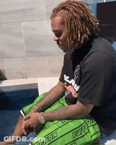 Man In Green Shorts Saying Puffy By Pool GIF