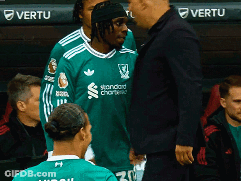 Man In Green Standard Chartered Shirt Talking To Another Man GIF