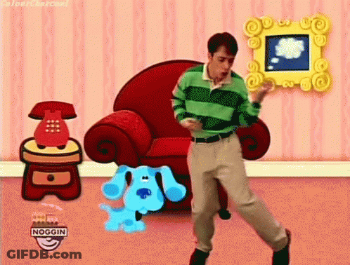 Man In Green Striped Shirt Dancing With Blue Dog In Front Of Red Chair GIF