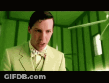 Man In Green Suit And Bow Tie GIF