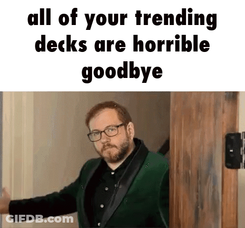 Man In Green Suit And Glasses Standing Before Wooden Door GIF