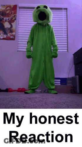 Man In Green Suit And Glasses Standing In Front Of Wooden Door GIF