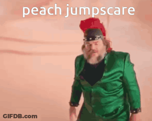 Man In Green Suit And Red Hat Peach Jumpscare GIF