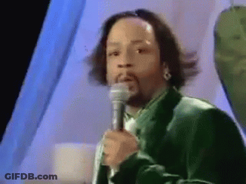 Man In Green Suit Holding Microphone GIF