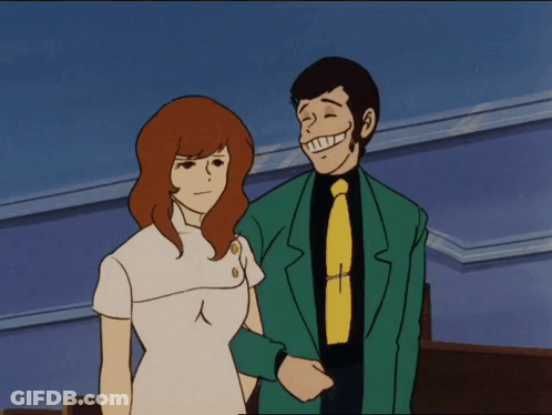 Man In Green Suit Next To Woman GIF