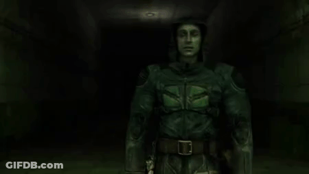 Man In Green Suit Standing In Dark Hallway GIF