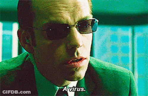 Man In Green Suit Sunglasses Says A Virus GIF
