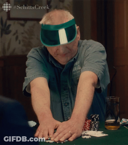 Man In Green Sun Visor Playing Poker GIF