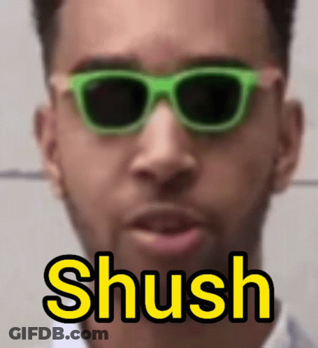 Man In Green Sunglasses Saying Shush In Yellow GIF