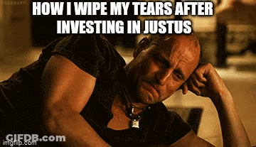 Man In Green Superhero Costume Kneeling On Bridge GIF