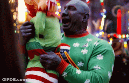 Man In Green Sweater Holding Stuffed Animal GIF