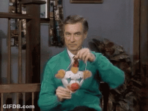 Man In Green Sweater Holding Stuffed Animal GIF