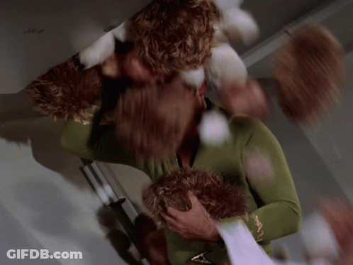 Man In Green Sweater Holding Stuffed Animal GIF