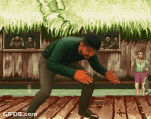 Man In Green Sweater Kneeling GIF