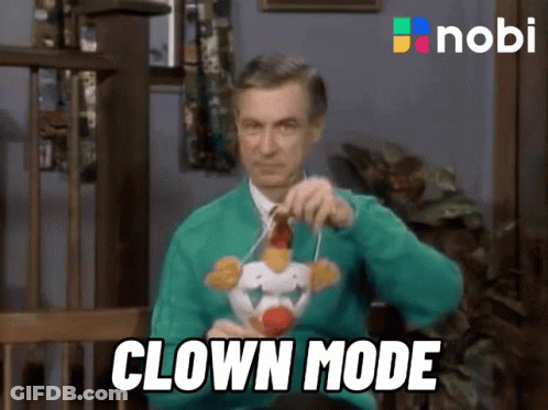 Man In Green Sweater With Stuffed Clown Clown Mode GIF