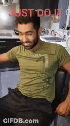 Man In Green T-Shirt Saying Armada Exchange GIF