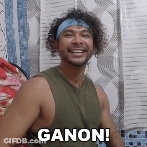 Man In Green Tank Top And Blue Headband Says Ganon GIF