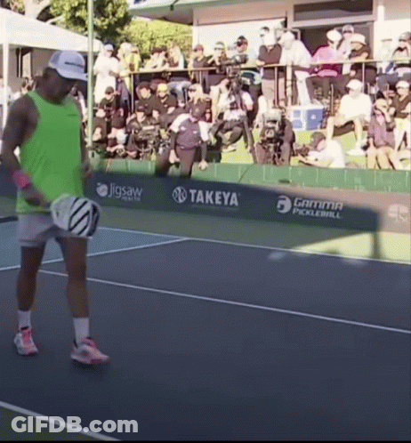 Man In Green Tank Top Holding Tennis Racket GIF