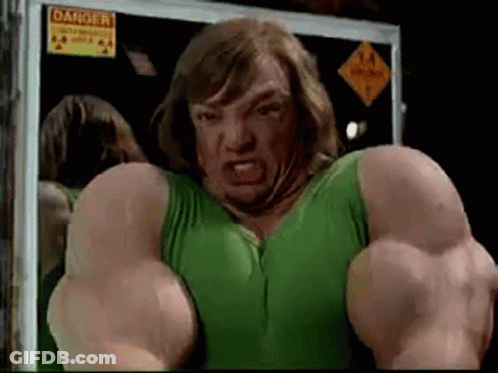 Man In Green Tank Top With Muscles In Front Of Danger Sign GIF