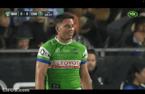 Man In Green Toyota Jersey In Front Of Crowd GIF