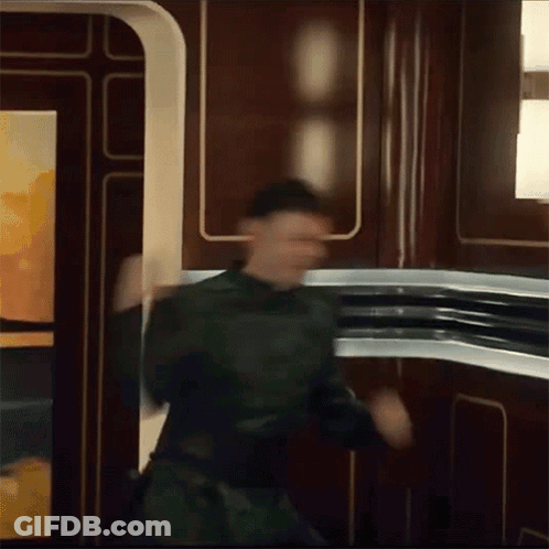 Man In Green Uniform Dancing GIF