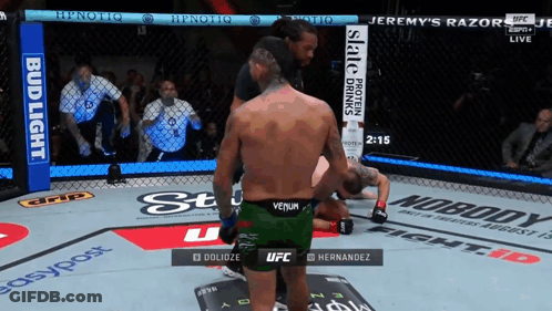 Man In Green Venom Shorts Boxing Another Man GIF