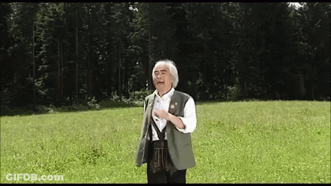 Man In Green Vest In Field GIF