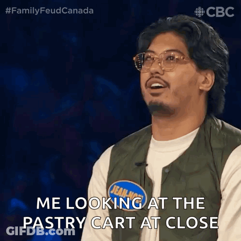 Man In Green Vest Looking At Pastry Cart GIF