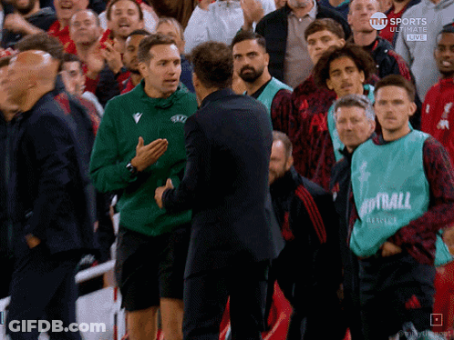 Man In Green Vest Saying Football GIF