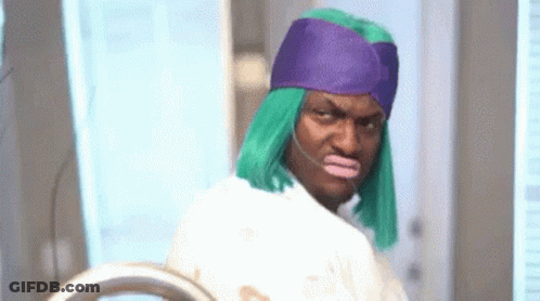 Man In Green Wig And Purple Hat At Mirror GIF
