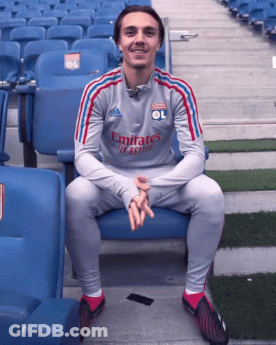 Man In Grey Emirates Fly Better Shirt Sitting In Stadium GIF
