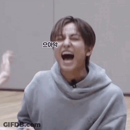 Man In Grey Hoodie Making Funny Face GIF