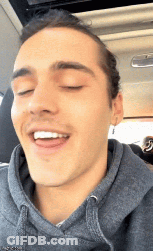 Man In Grey Hoodie Smiling Eyes Closed GIF